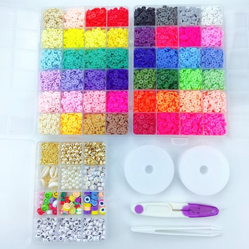 The Fashiongirl Clay Beads / Heishi Beads Arona Kit is a KREA DIY jewellery kit featuring 12,000 colorful beads, including alphabet, round, gold, and pearl styles, plus two rolls of string, a bead threader, and tweezers.