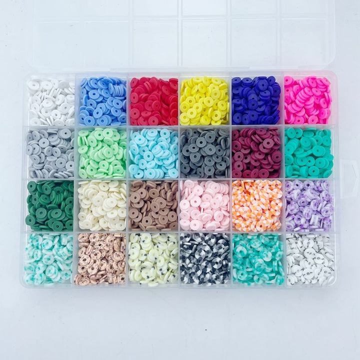 The Fashiongirl KREA DIY Jewellery Kit includes 6000 colorful Clay Heishi Beads in a plastic box with 24 compartments, perfect for bohemian jewellery making. Features white, red, yellow, blue, green and mixed patterns.