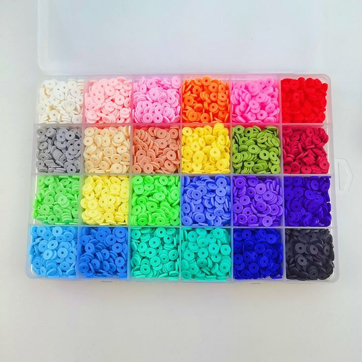 The Fashiongirl Clay Beads / Heishi Beads Merkki Kit - KREA DIY Jewellery Kit includes 7000 colourful beads in 24-compartment plastic organizer, featuring shades like white, pink, red, orange, yellow, green, blue, purple, brown, black and gray.