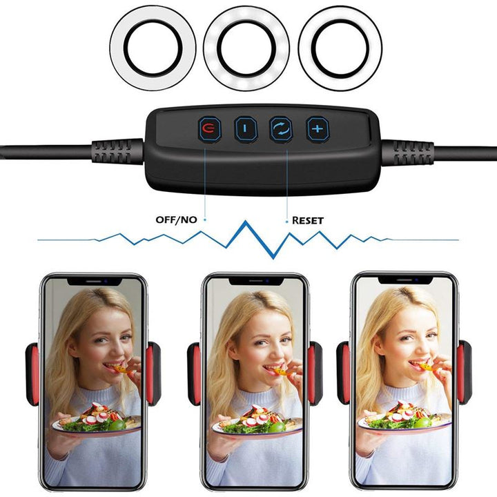 The UNIQ Selfie Ring Light with adjustable LED brightness and flexible arms features remote control for power, mode, reset, and brightness. Three phones show a woman eating salad under customizable light settings—ideal for streaming or makeup.