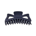 The SOHO Astrid Hair Claw in Navy features a matte dark blue finish, wide curved teeth, and an open geometric top—ideal for securing thick hair.