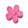 The SOHO Bloom Hair Claw - Pink by SOHO features a cute six-petal pink flower design with a central button, shown from above on a plain white background.