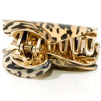 A close-up of the SOHO Hair Claw - Leopard by SOHO showcases its gold acrylic design with a leopard motif, spring mechanism, and curved scalloped edges.