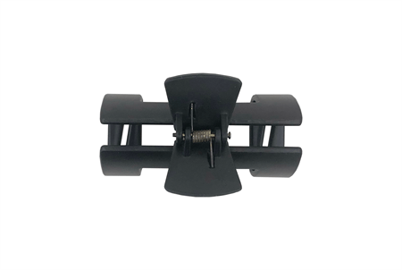 The SOHO Hollow Hair Claw - Black by SOHO features a black, rectangular design with curved jaws and a central spring mechanism—an essential accessory for effortless hair styling.