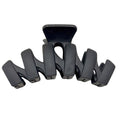 The SOHO Just Hair Claw - Black by SOHO features five wide, curved prongs for a secure hold and sleek style, making it the perfect accessory to keep your hair in place.