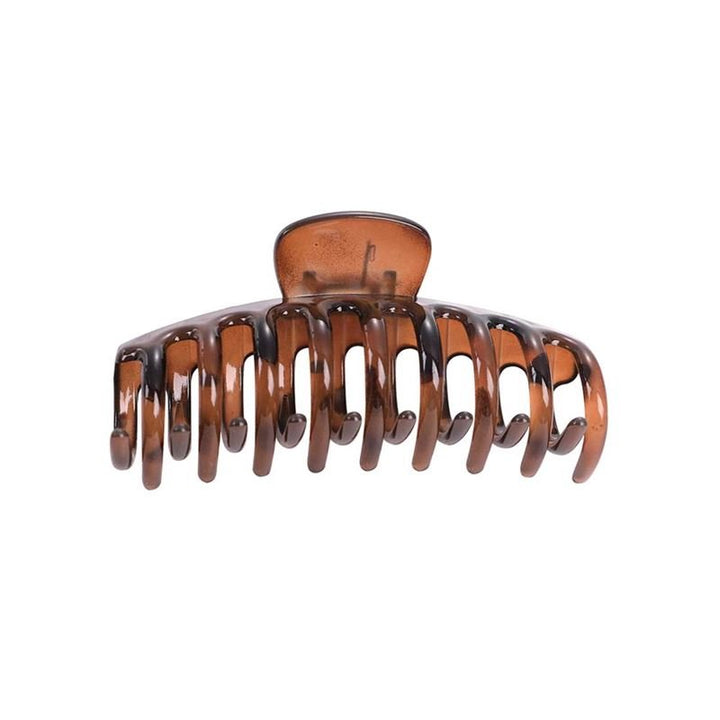 The SOHO Kana Hair Claw - Tortoise is a large brown plastic clip by SOHO with curved prongs and a spring hinge, offering a strong grip for all hair types and keeping your hair secure and in place.