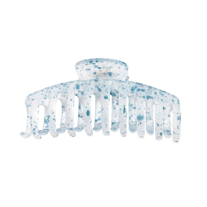 The SOHO Kana Splash Hair Claw - Blue by SOHO features a translucent plastic design with blue and white speckles and wide, curved teeth for a strong grip. Suitable for all hair types.