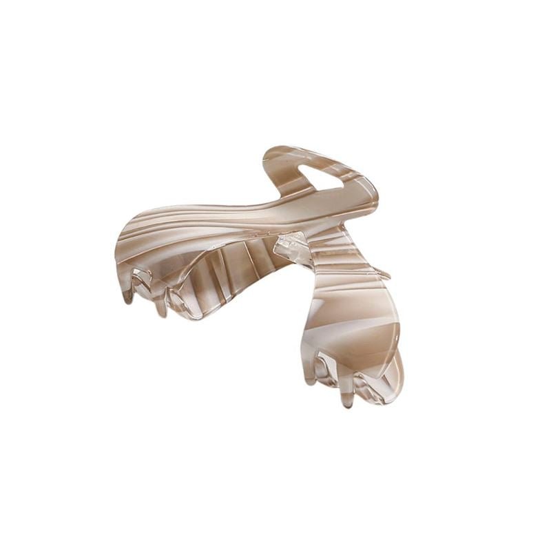 The SOHO Malou Hair Claw - Brown by SOHO features a beige and white marbled pattern with a curved, interlocking design, shown on a white background.