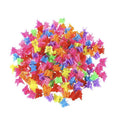 A playful cluster of SOHO Mini Butterfly Hair Claws—50 multicolour hair decorations in vibrant shades—scattered on a white background.