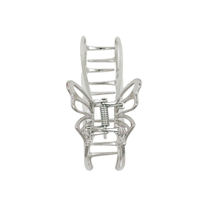 The SOHO Nabi Hair Claw - Silver by SOHO is a metal butterfly hair clip with openwork wings and a spring mechanism—ideal for adding elegant hold to your updo.