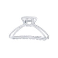 The SOHO Tori Small Metal Hair Claw in matt silver features a spring hinge and ridged teeth for secure messy bun styling—a stylish SOHO accessory shown against a white background.