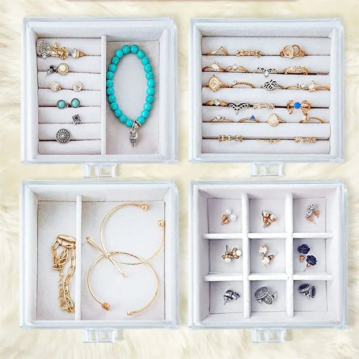 The UNIQ Acrylic Jewellery Organiser (SF 1142) features four velvet-lined drawers and two earring holders, perfect for neatly storing rings, earrings, bracelets, and necklaces in separate compartments.