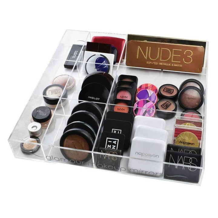 The UNIQ Acrylic Organiser tray for makeup/jewellery features 12 compartments, perfect for neatly storing eyeshadow palettes, blushes, powders, and compacts from your favorite brands for effortless organization.