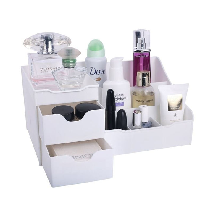 The UNIQ Organiser for makeup & skincare products in white by UNIQ features 9 compartments to neatly store perfume bottles, deodorant, creams, lipsticks, makeup jars, and lotion tubes.
