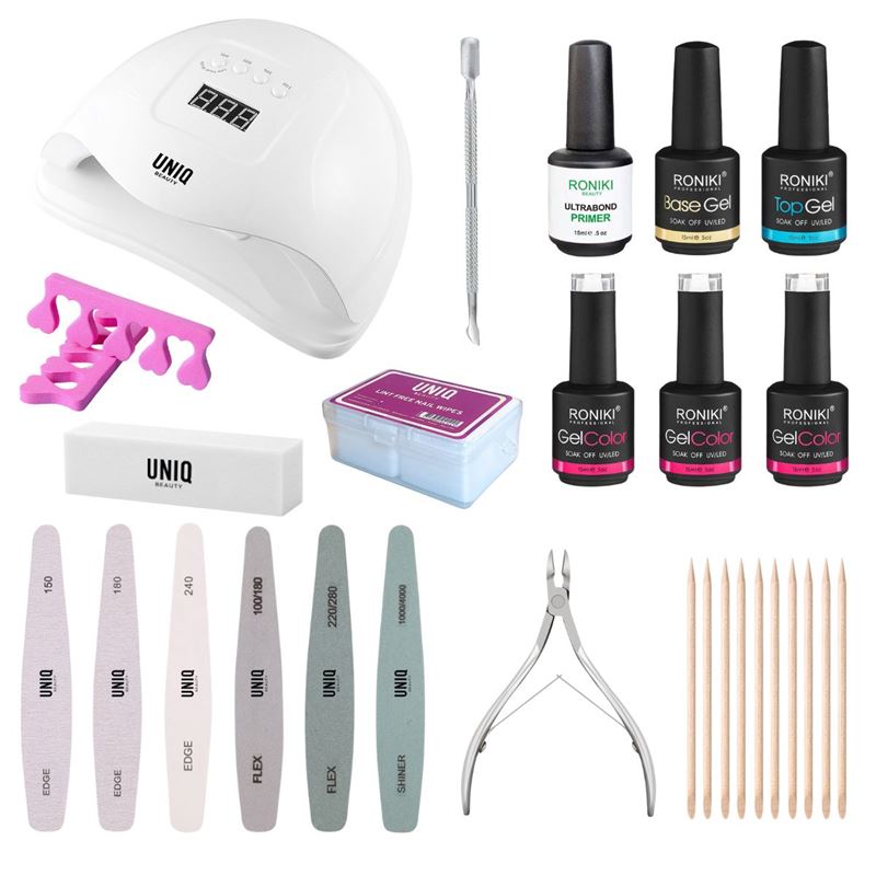 The UNIQ Premium Gel Polish Starter Kit by UNIQ features a UV/LED lamp, gel polishes, files, buffers, toe separators, cuticle pusher, clippers, orange sticks, and a storage box—all displayed on a white background. Make gel polish at home!.