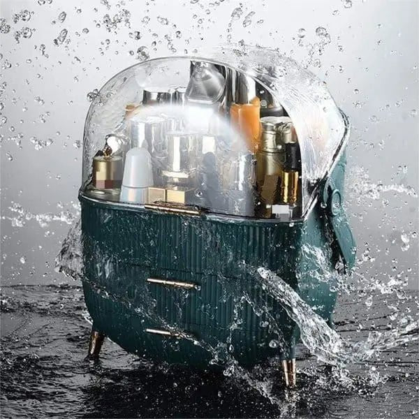 The UNIQ Retro Makeup Box Organiser in Dark Mint/Dark Green features a clear lid and multiple compartments, keeping your cosmetics dry and protected even when splashed with water.