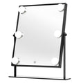 The UNIQ XL Hollywood Mirror with LED Lights & Touch Control by UNIQ features a sleek black frame, six round LED lights, and a touch power button. It includes a sturdy stand, making it perfect for your makeup routine.